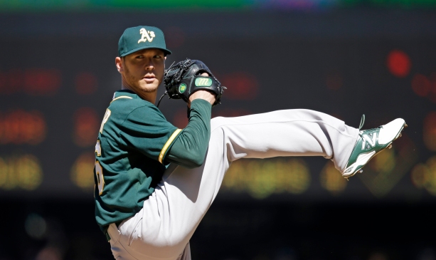 Oakland Athletics starting pitcher Scott Kazmir throws against the Seattle Mariners in the second inning of a baseball game Sunday, April 13, 2014, in Seattle. (AP Photo/Elaine Thompson)